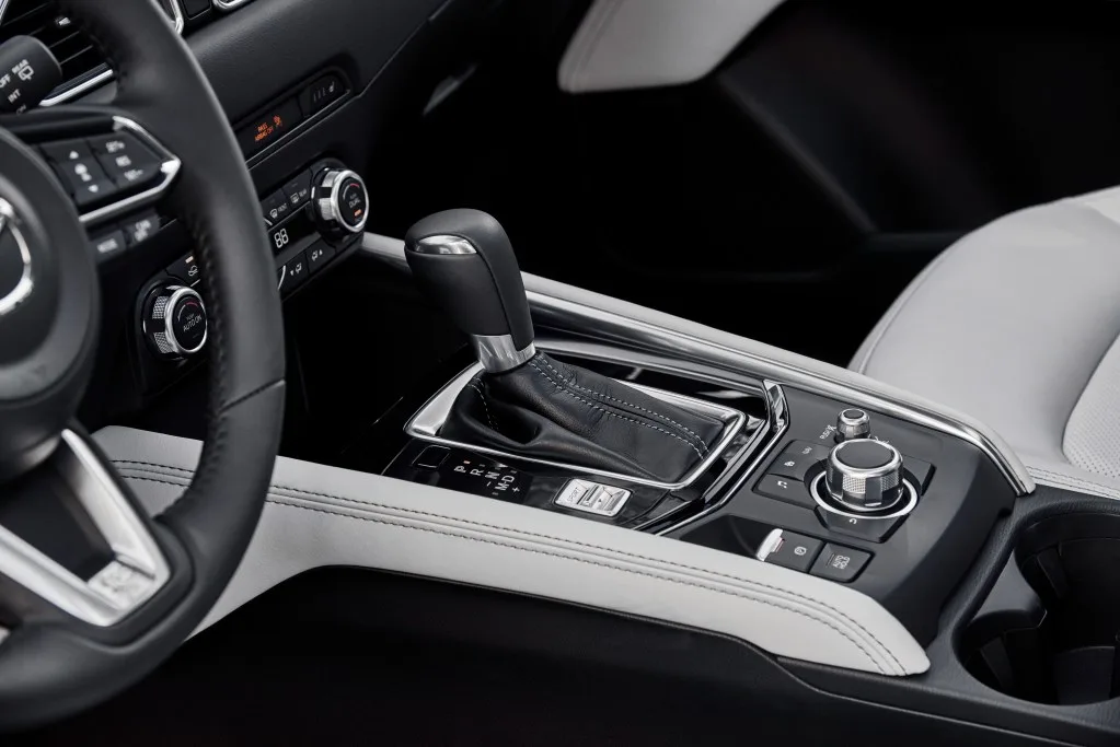 Mazda CX-5 features the layered wood trim, leather-trimmed seats, and premium stitching create one of the most luxurious cockpits in its class.