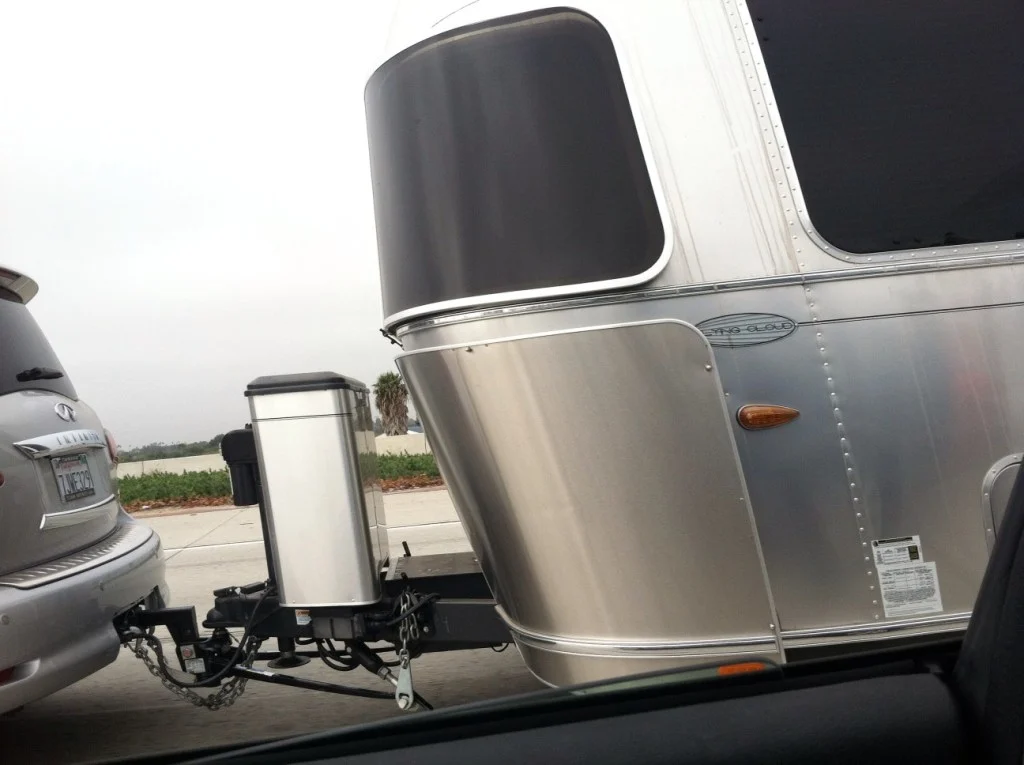 Distribute the weight so that around 60% is in the front half and don't overload your RV trailer to reduce sway.