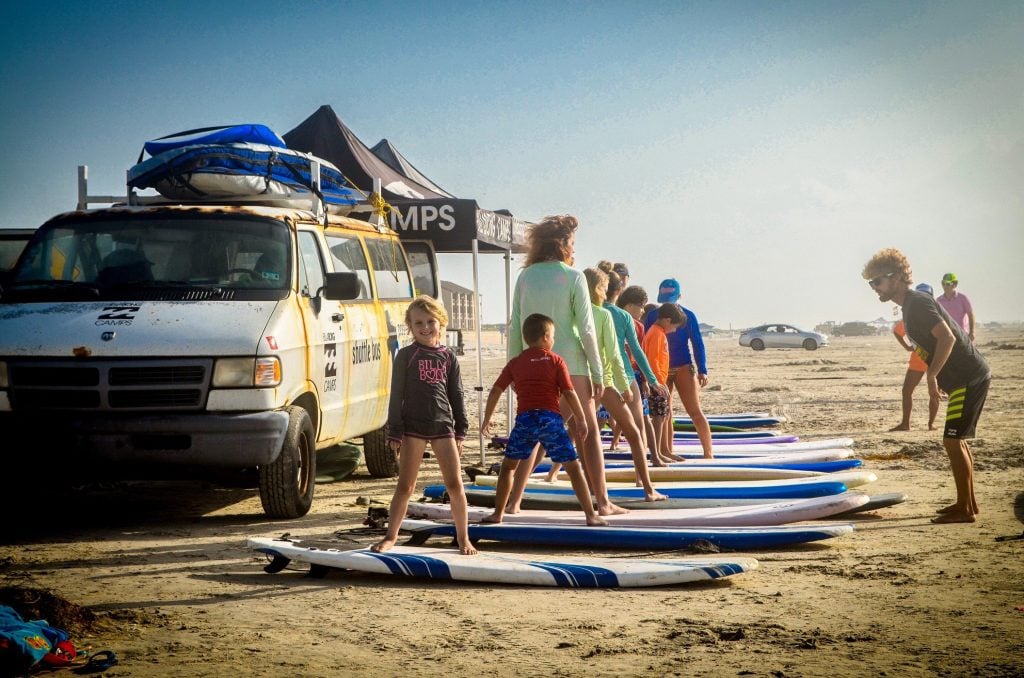 beach camping in California. learn to surf
