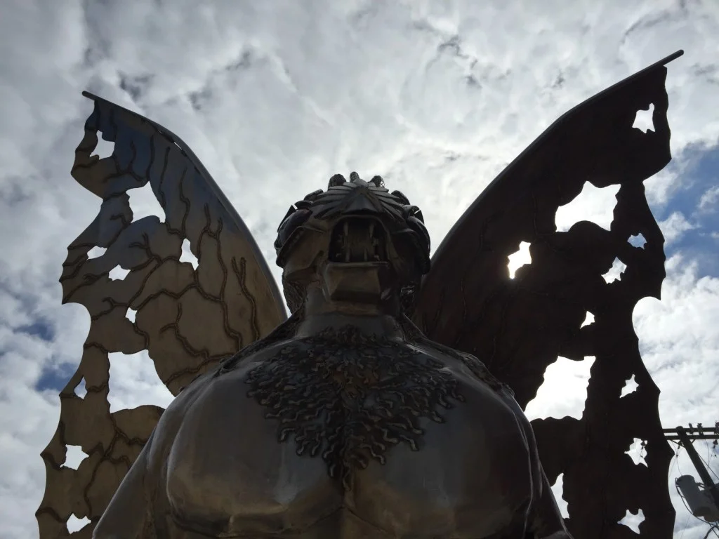 Close up of the Mothman sculptures face.