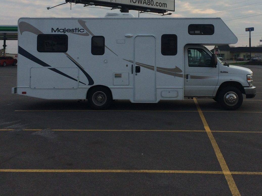 RV parked overnight in an empty lot.
