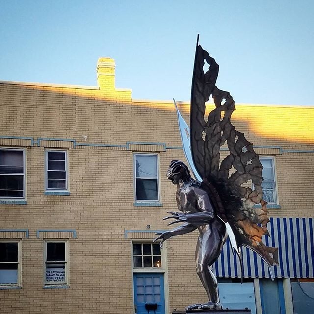 Profile view of the Mothman statue.