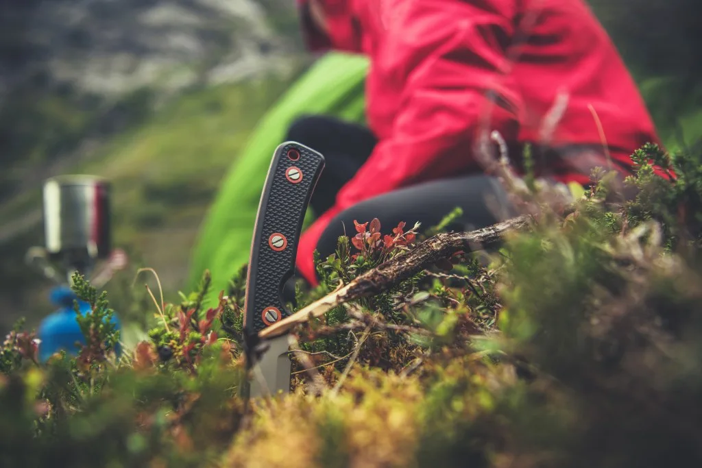 Knife being used by a camper.