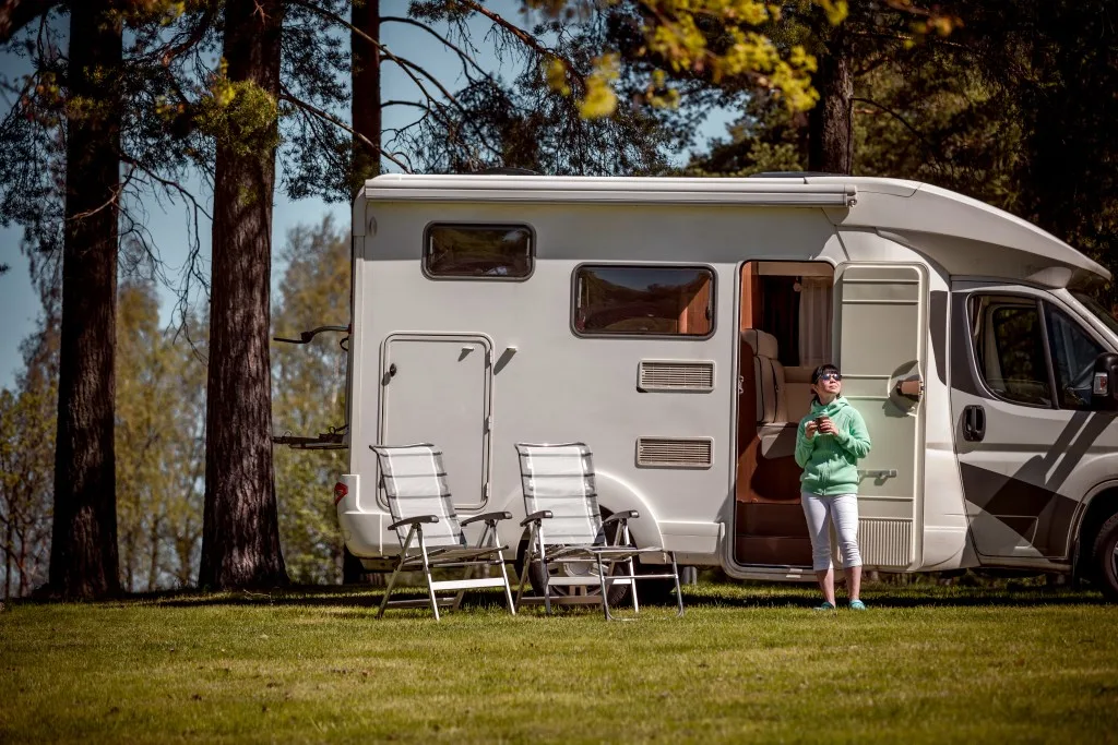 Woman standing in front of camper