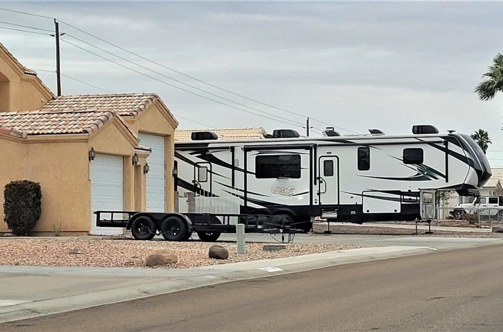 Big RV parked in a small driveway.