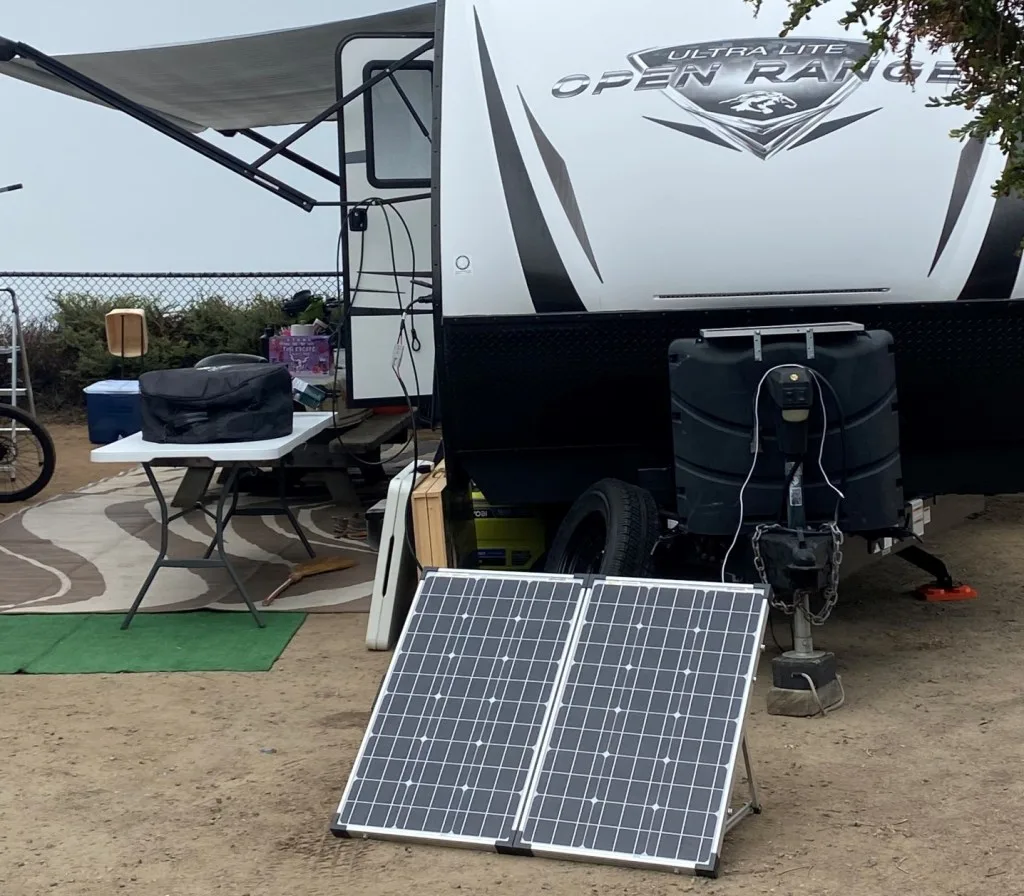 RV parked with solar panels out.