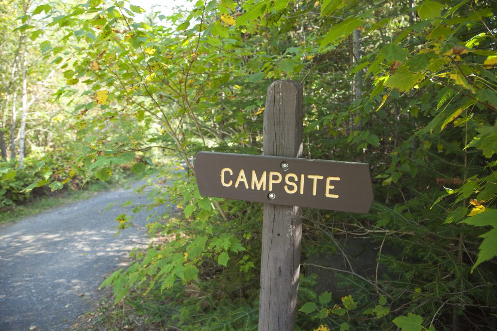 Sign on path to a campsite.