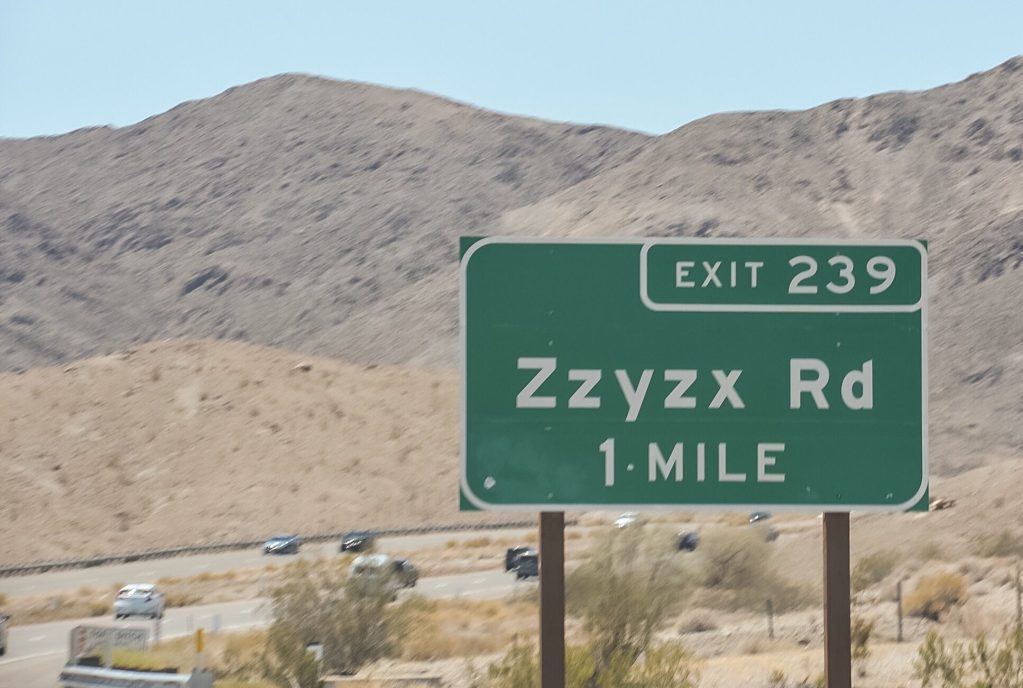 Close up of Zzyzx Rd exit sign.