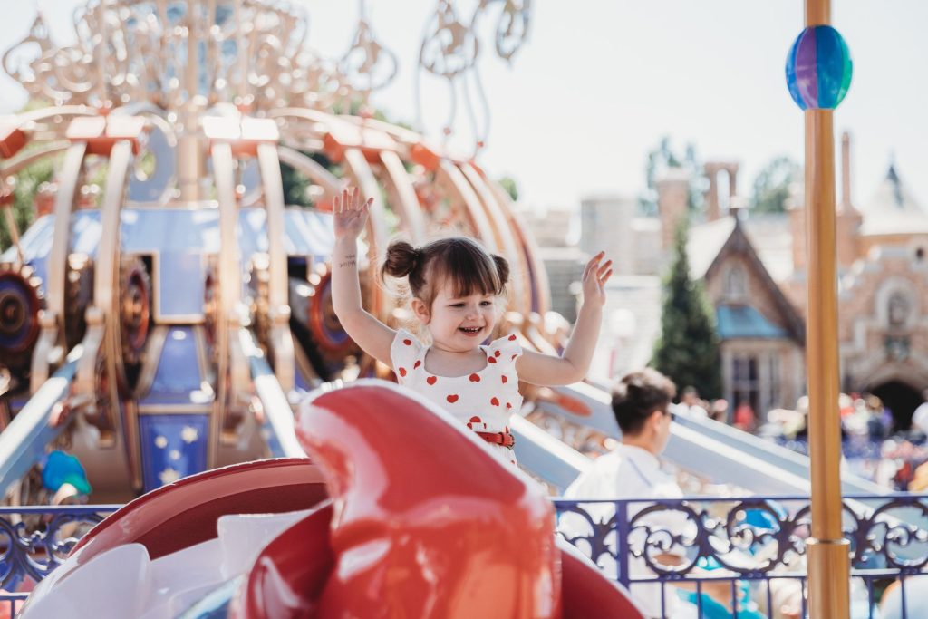 Little girl on ride at Disney World.