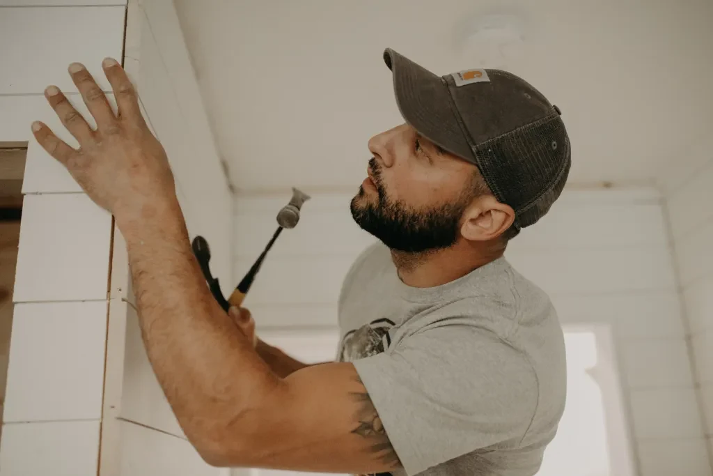 Man installing shiplap.