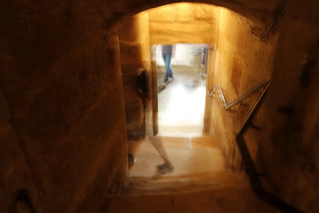 Ghost image walking through a cellar
