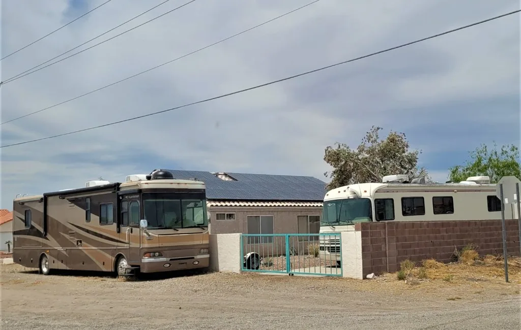 RV parked at friends house in desert.