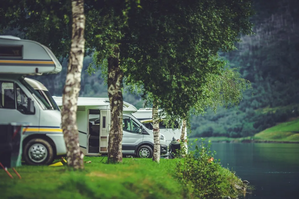 RV Park along water with RVs in them.