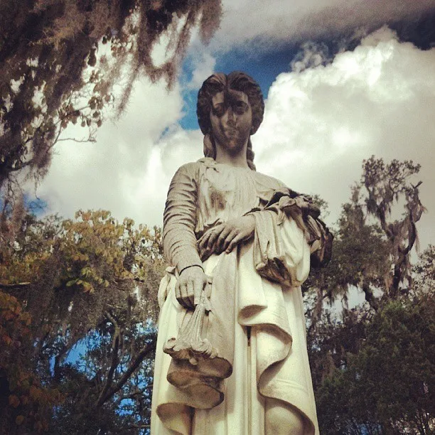 Female statue in cemetery 