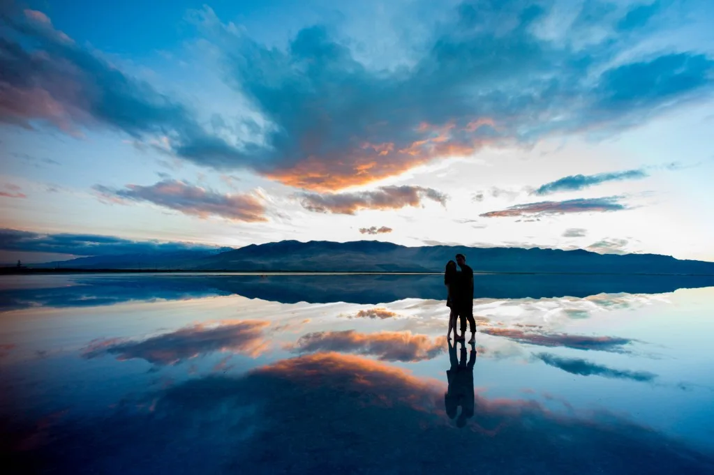 Couple posing at sunset in the Great Salt Lake.