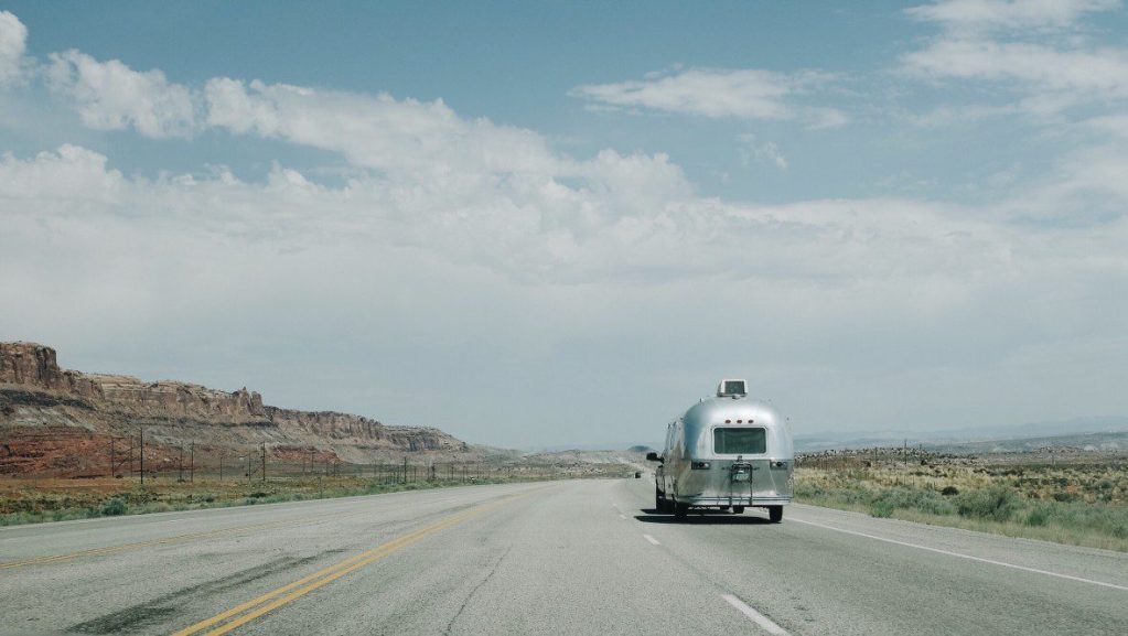 Airstream driving down a highway.