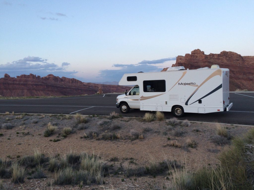RV driving on road.