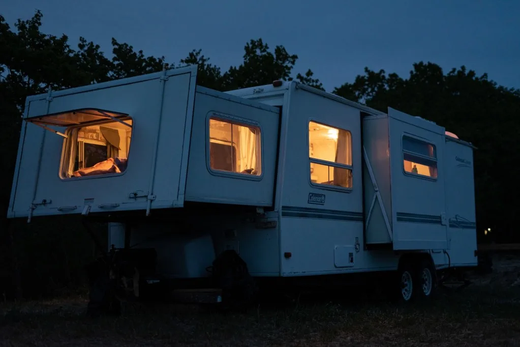 RV parked at night for camping.
