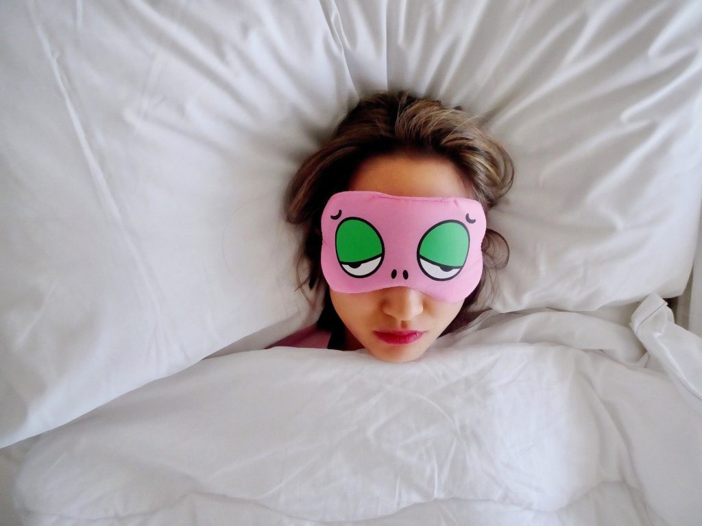 Woman sleeping in a sleep mask.