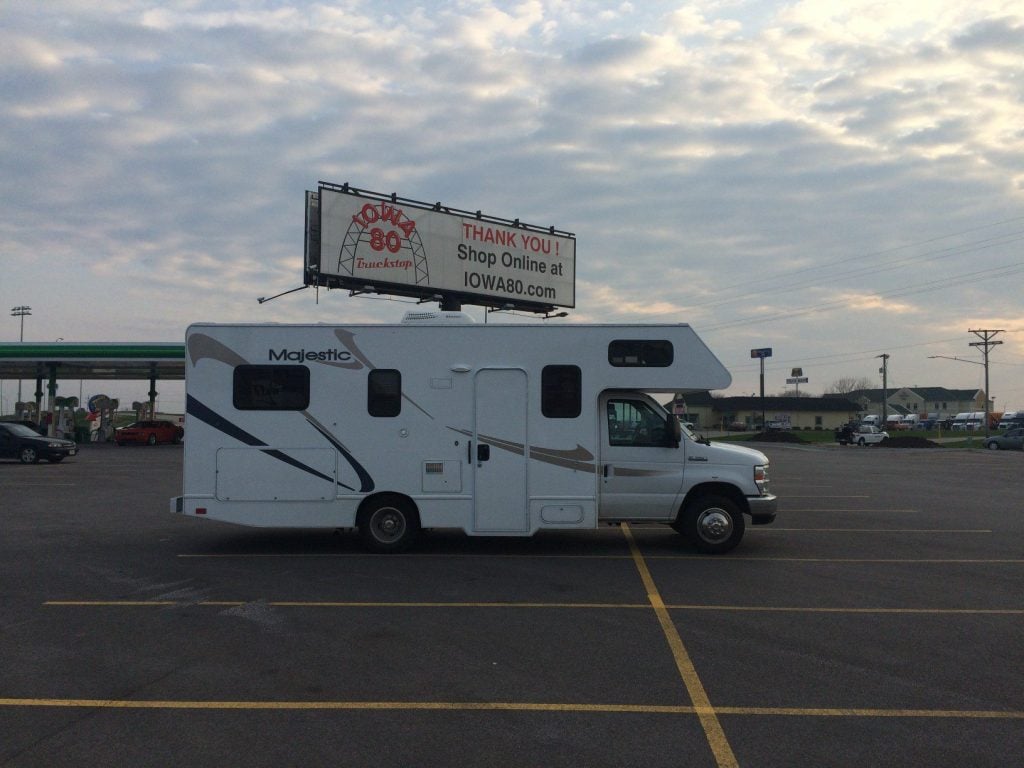 Single RV parked in parking lot.