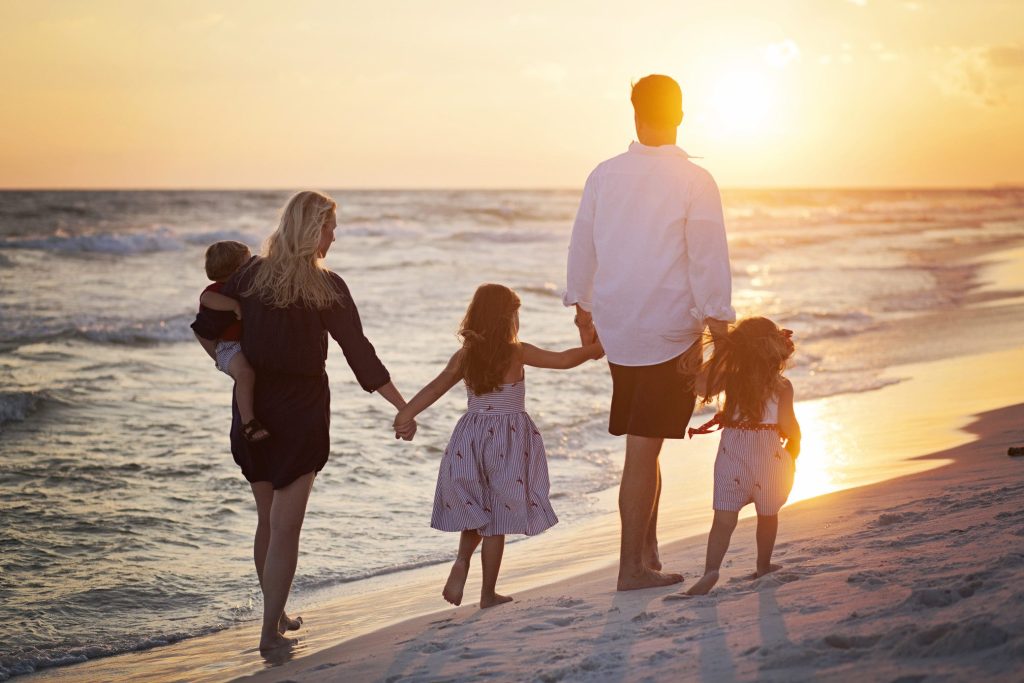 Family walking together on Florida beach
