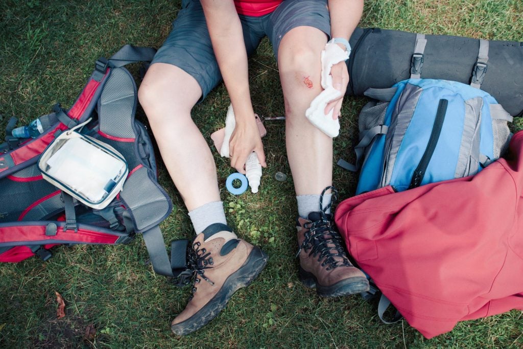 Persons leg bleeding while camping.