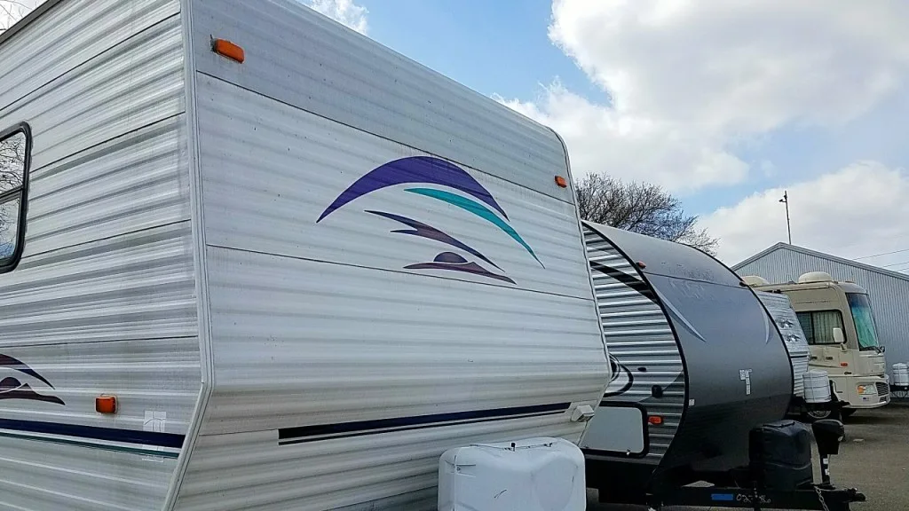 RVs parked in parking lot.