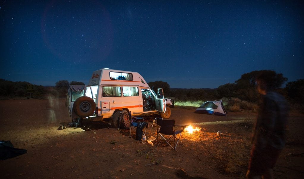 Camper Van parked at night at campsite