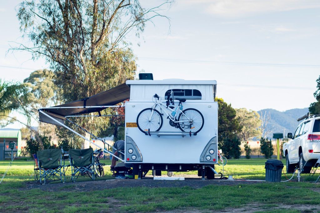 RV parked with bike on bumper rack