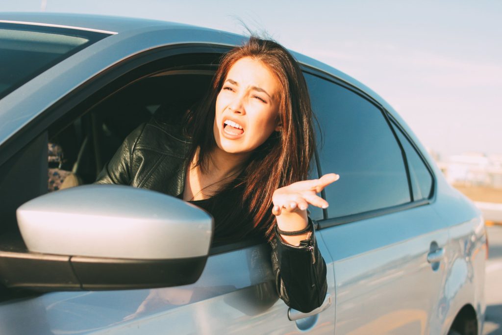 Woman angry while driving.