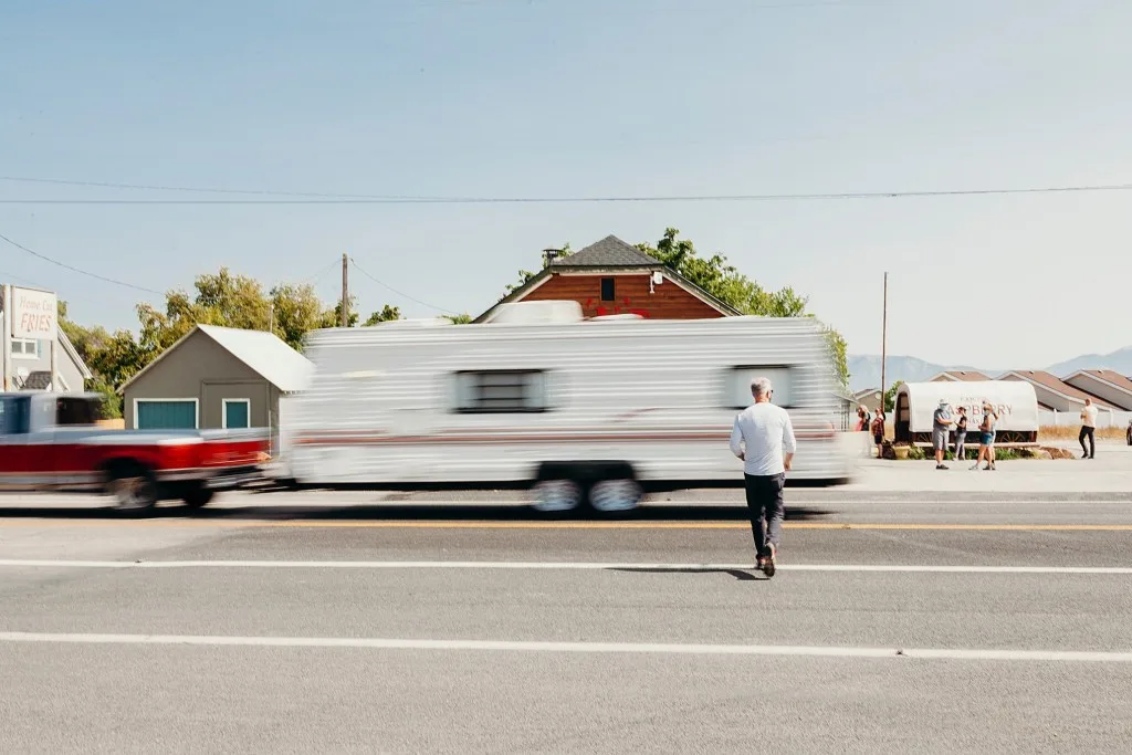 Man walking in front of RV