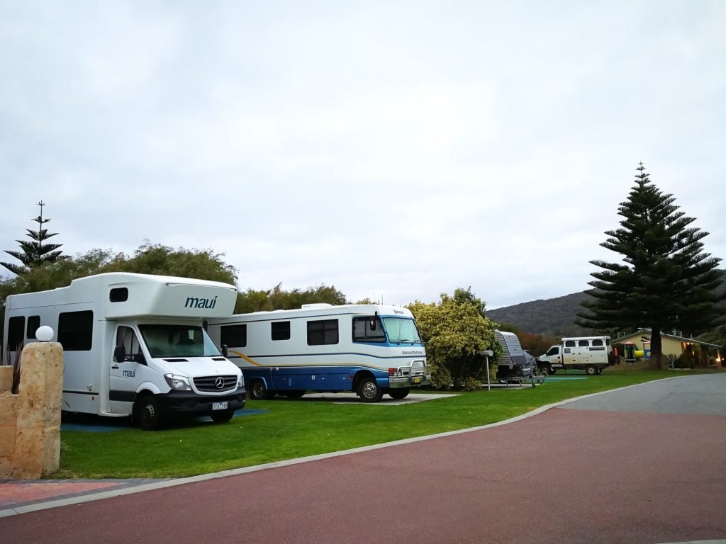 RVs parked at a crowded campsite.