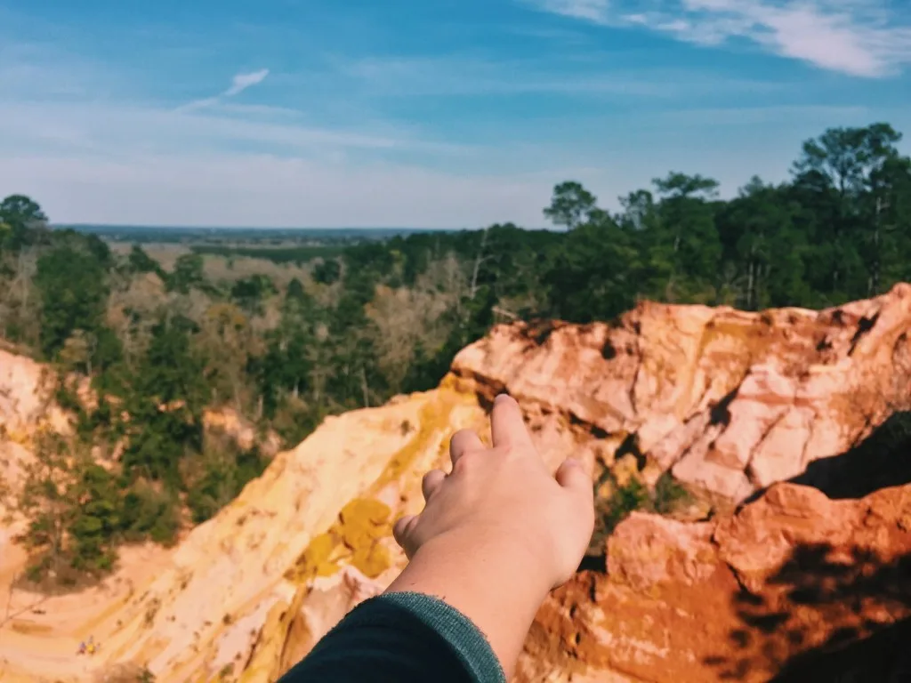 Person reaching out to Mississippi's Grand Canyon