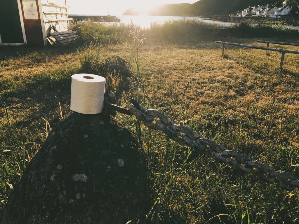 Toilet paper on post at campsite.