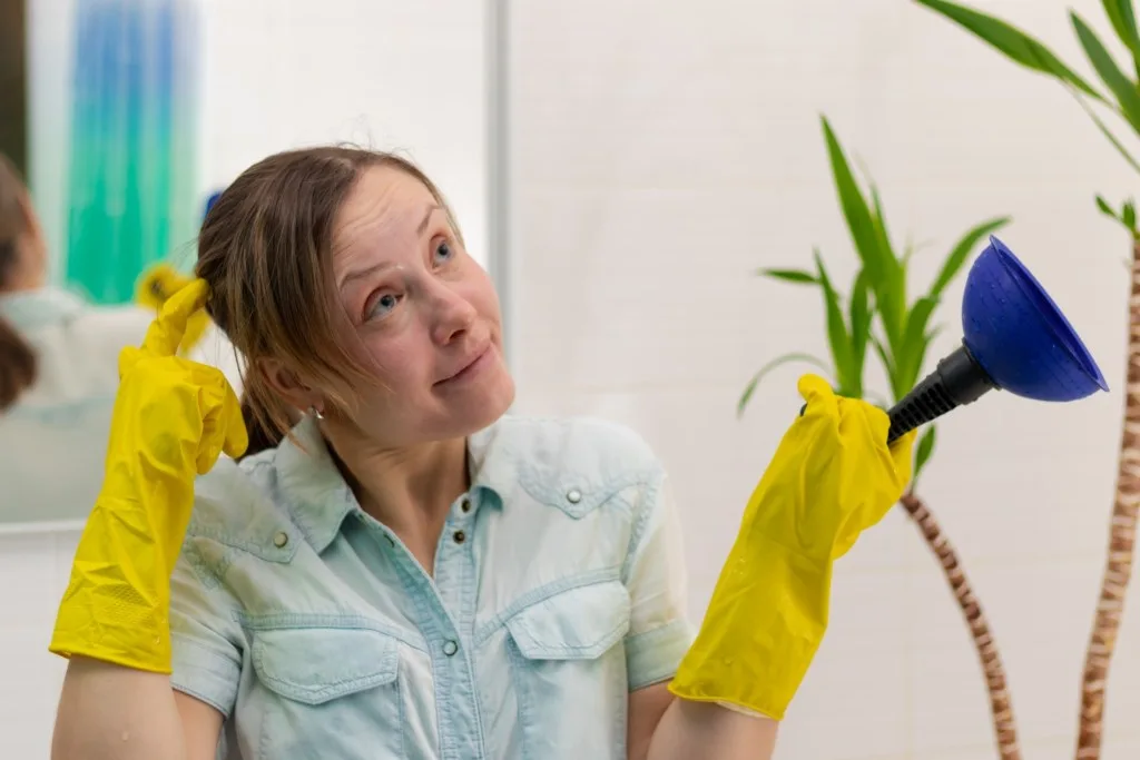 Woman confused in bathroom.