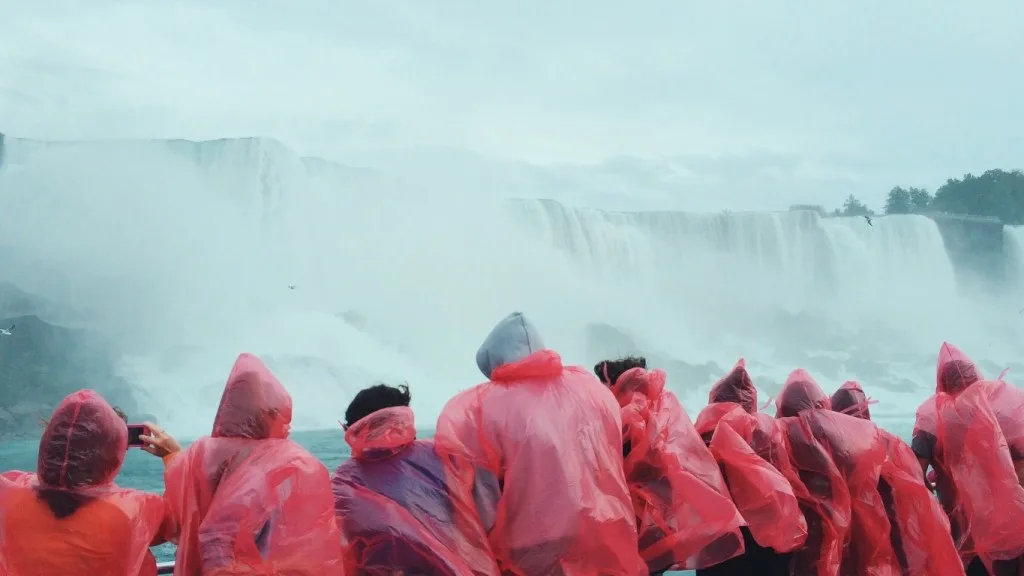 Group of tourists looking at Niagara Falls.