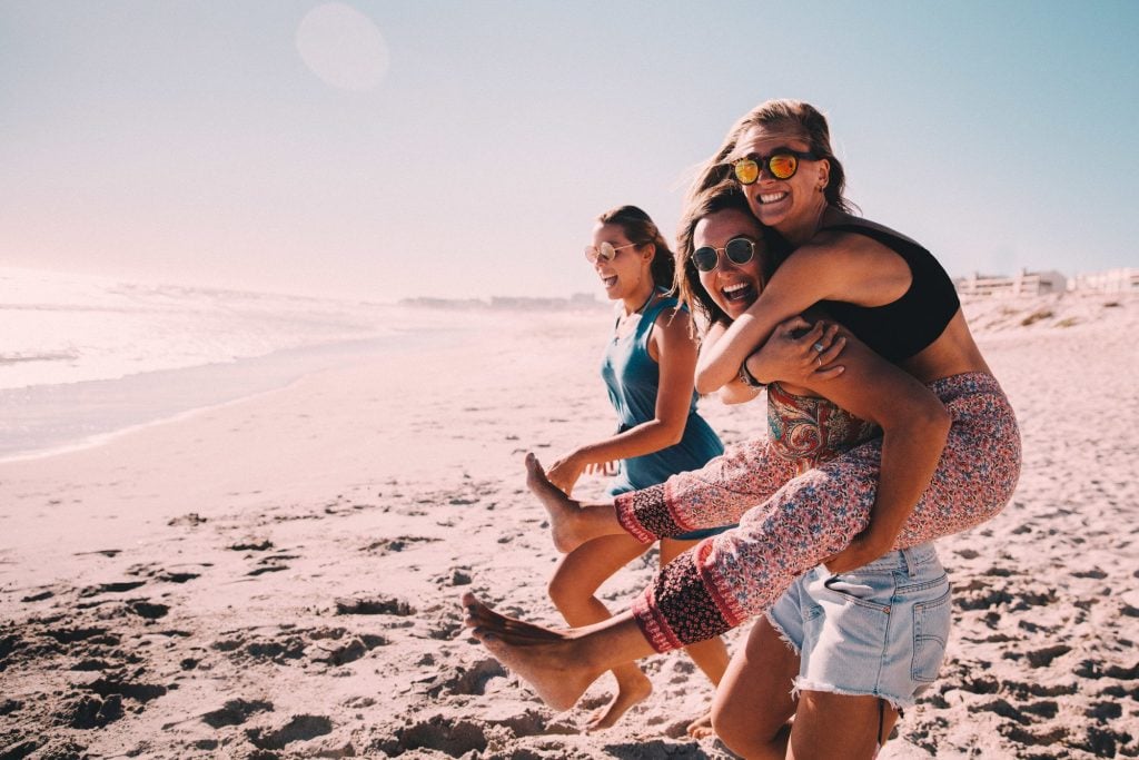 Three women friends enjoying Mustang Island State Park beach