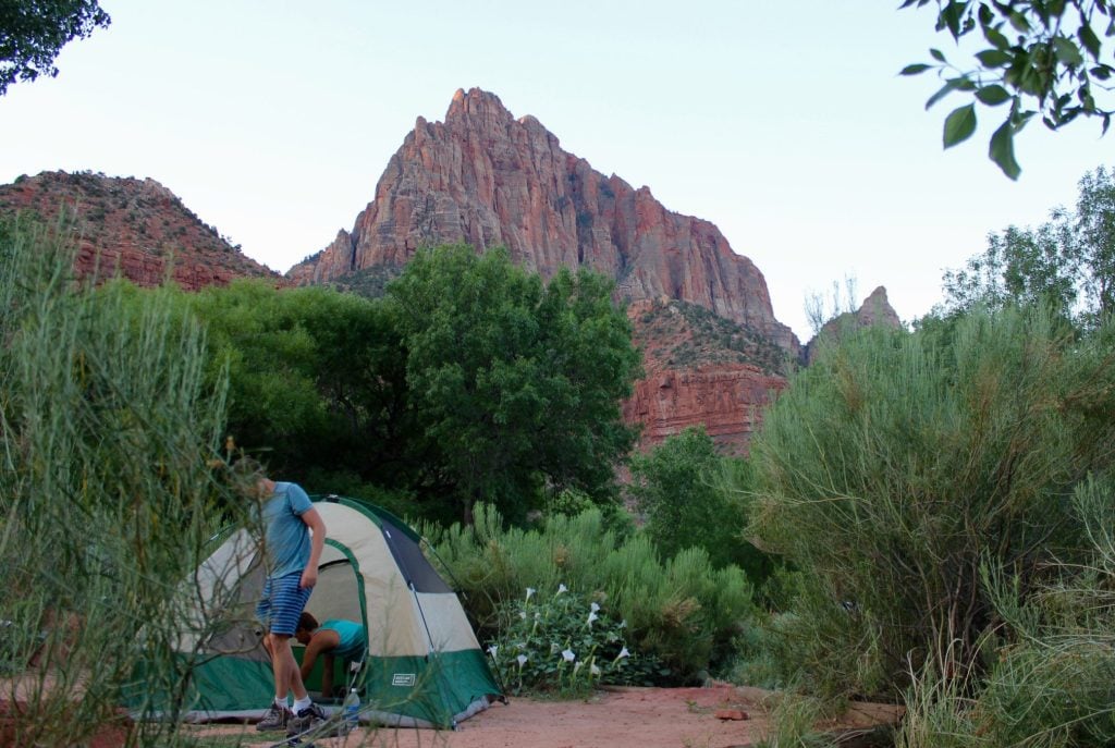 Man setting up tent in Zion National Park