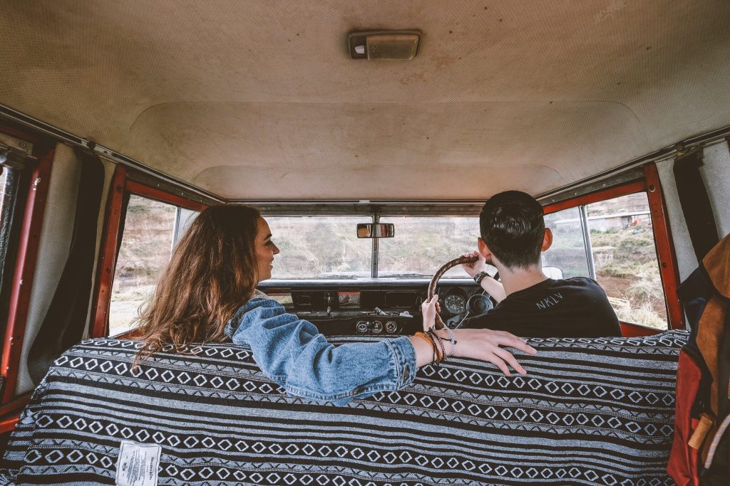 Couple driving old truck