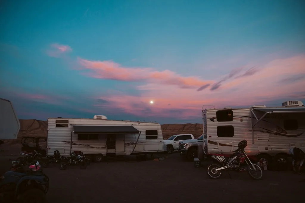 RVs parked at sunset