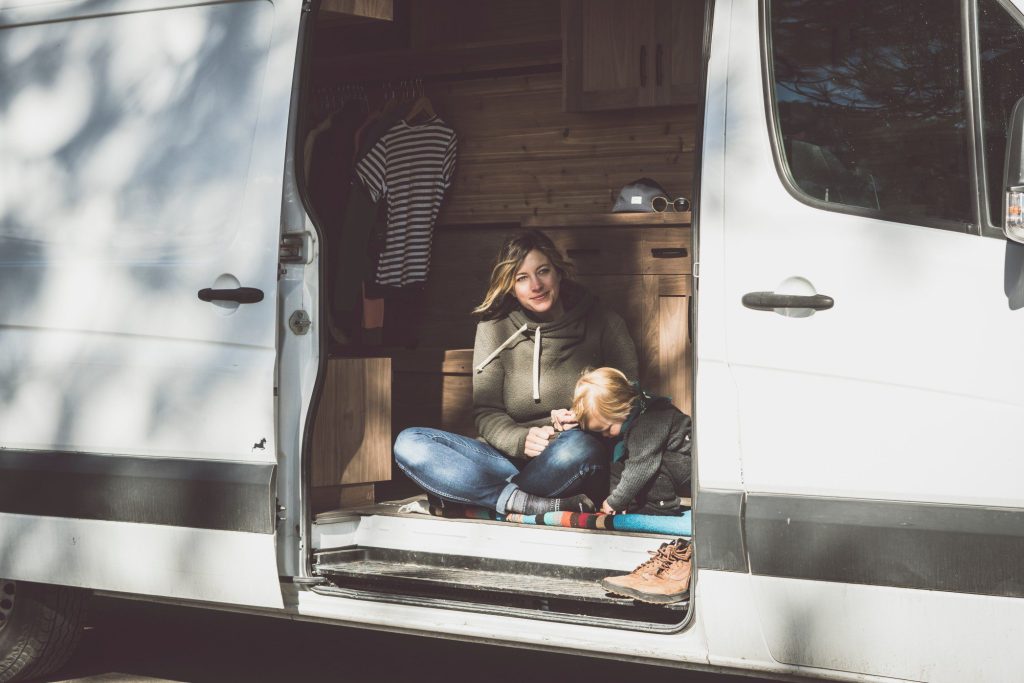 Mom and baby in camper van.