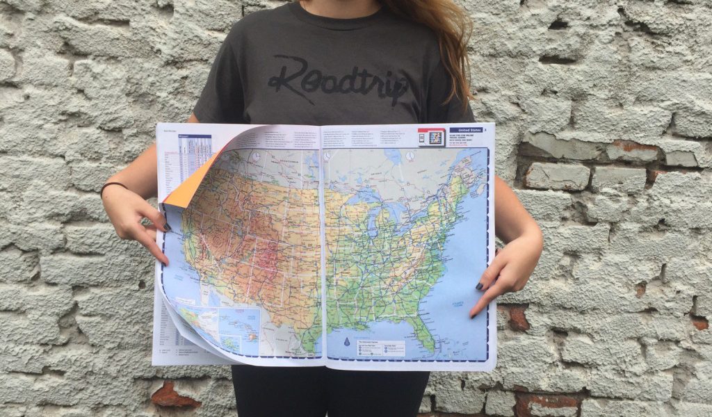 Woman holding map of America.