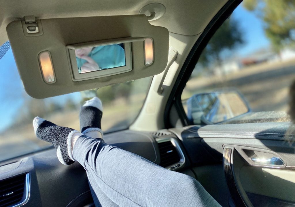 Person with feet on dashboard.