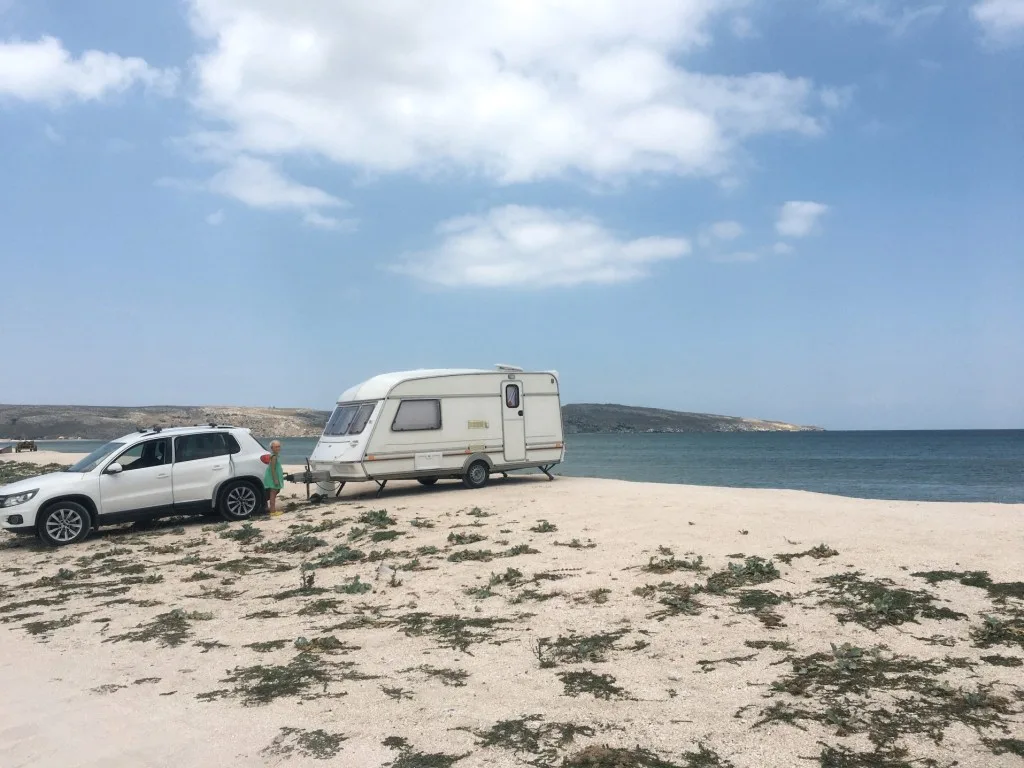 RV and toy hauler parked on beach in Texas