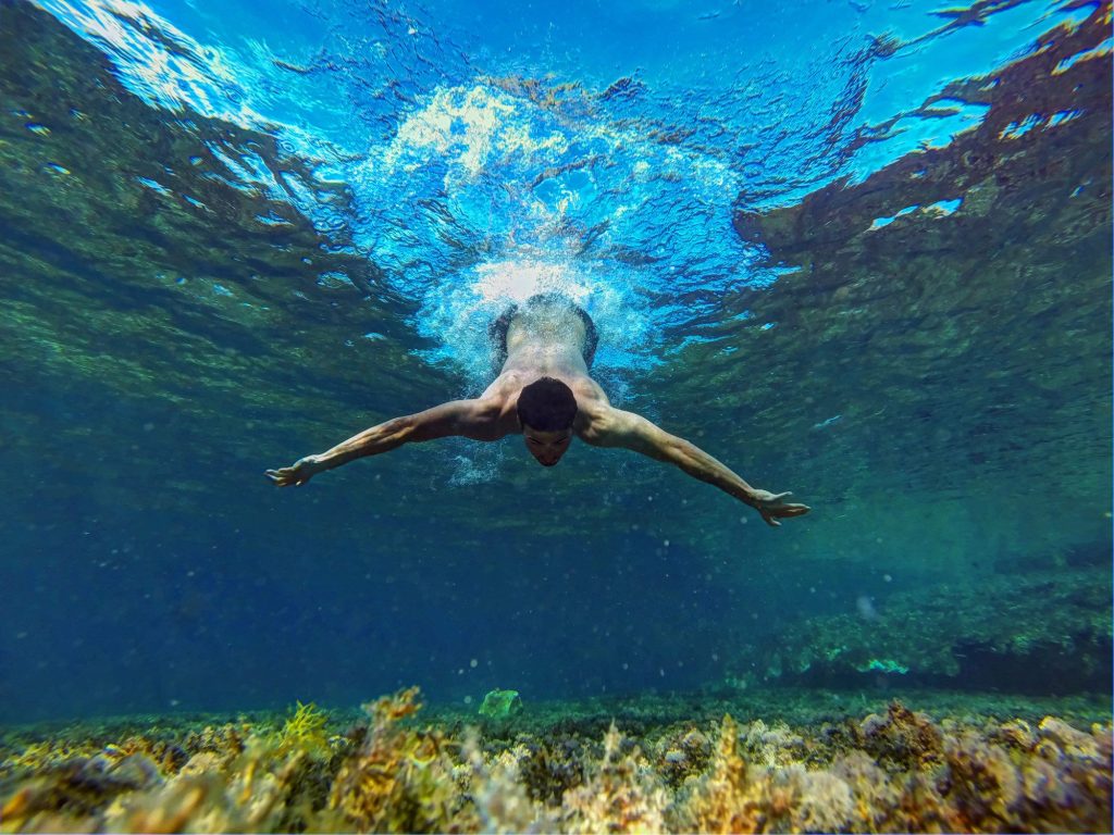 Person diving underwater