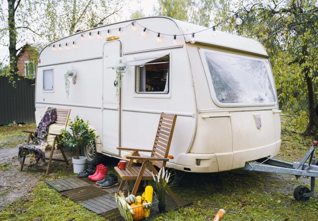 RV parked in a lawn at a home