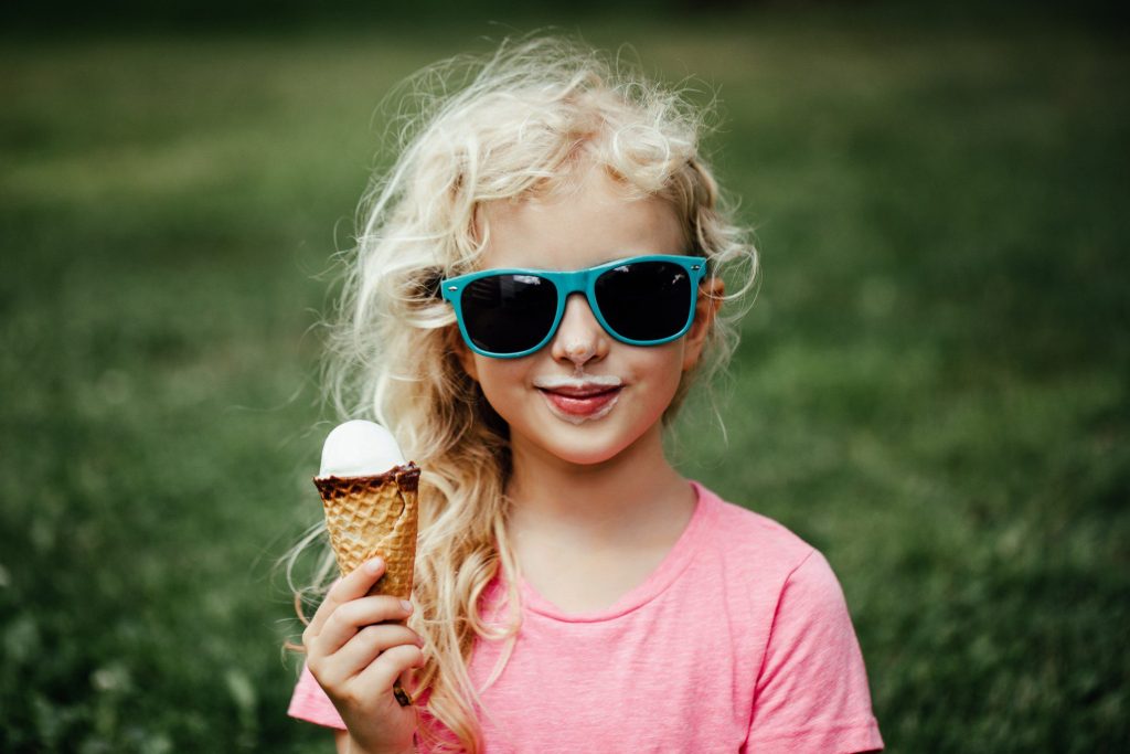 Little girl eating ice cream cone in Fairhope, Alabama