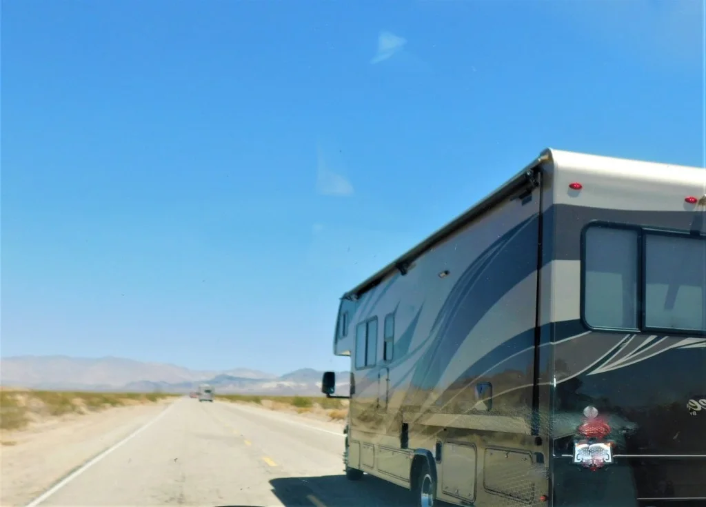 Class A RV driving down highway