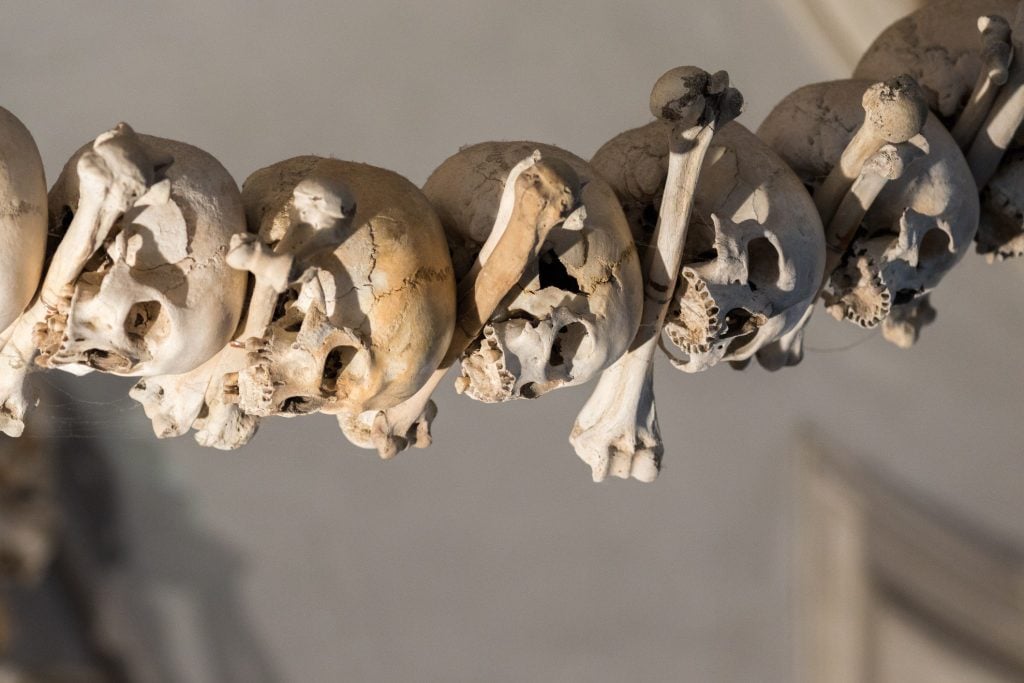 Bones hanging in Brno Ossuary