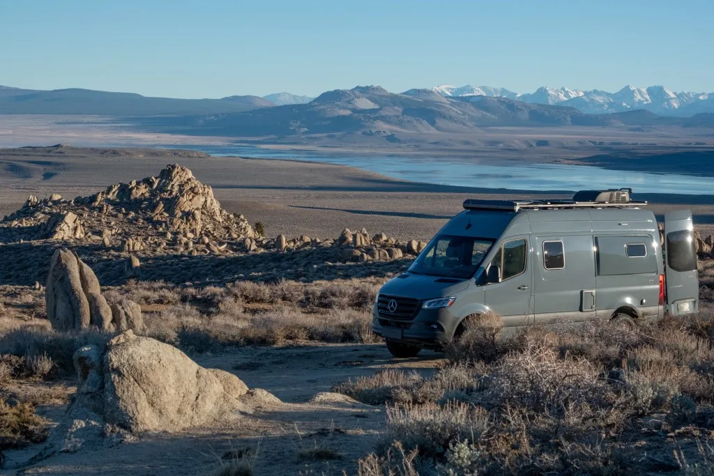 Sprinter van parked next to ocean